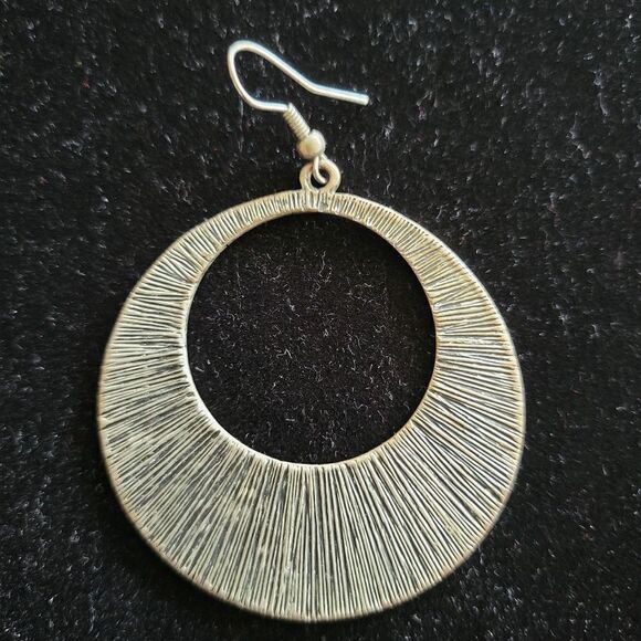 Large silver tone textured earring. Fashion Jewelry - Picture 3 of 3
